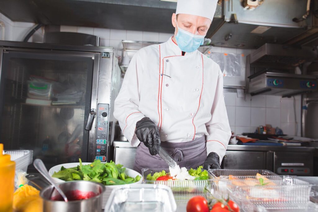 Temporary chef making takeaway salads