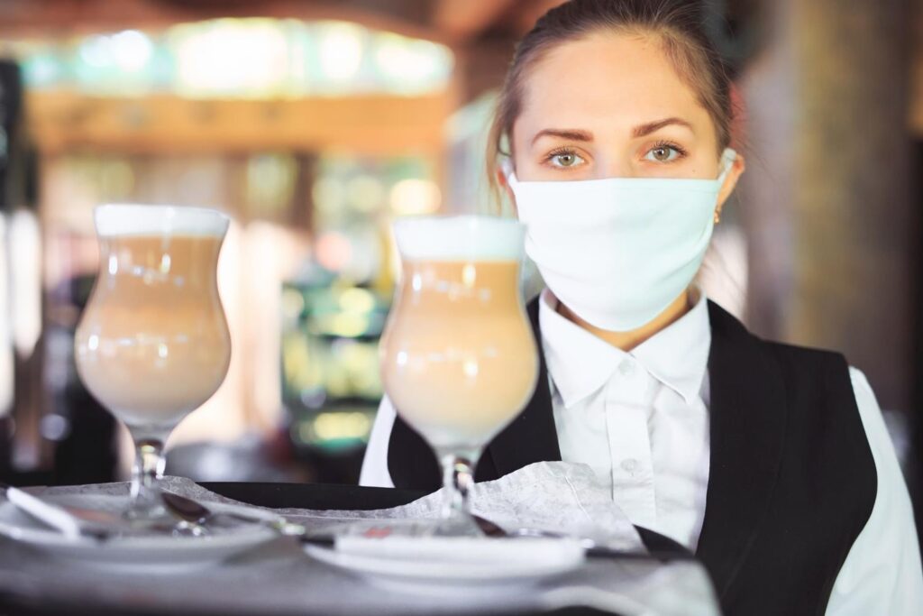 Temporary waitress serving latte coffee